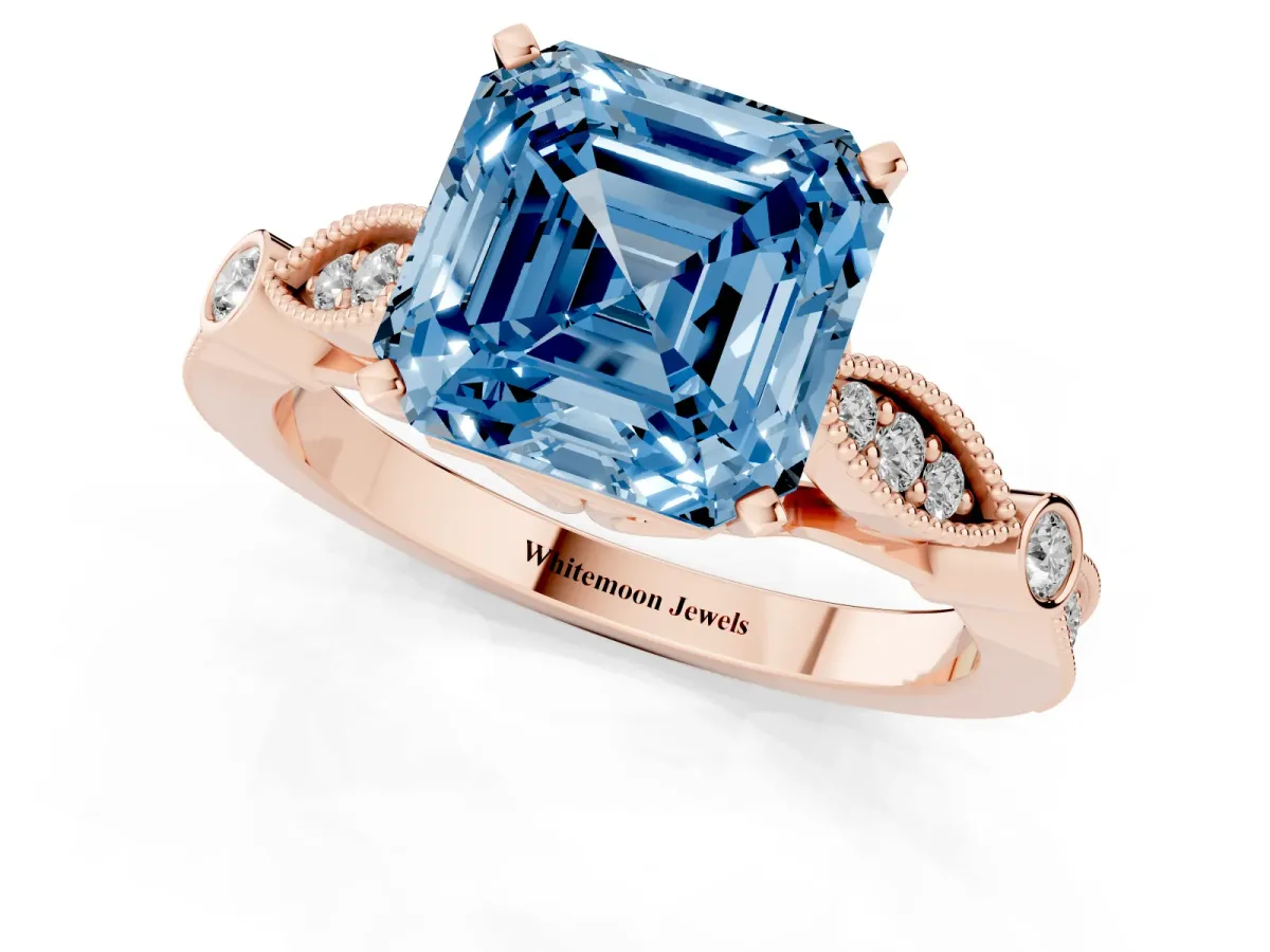 Fancy Blue Asscher Cut Cut Diamond with Milgrain Marquise and Bezel Accents on a Solitaire Band with Prong Setting Rose gold