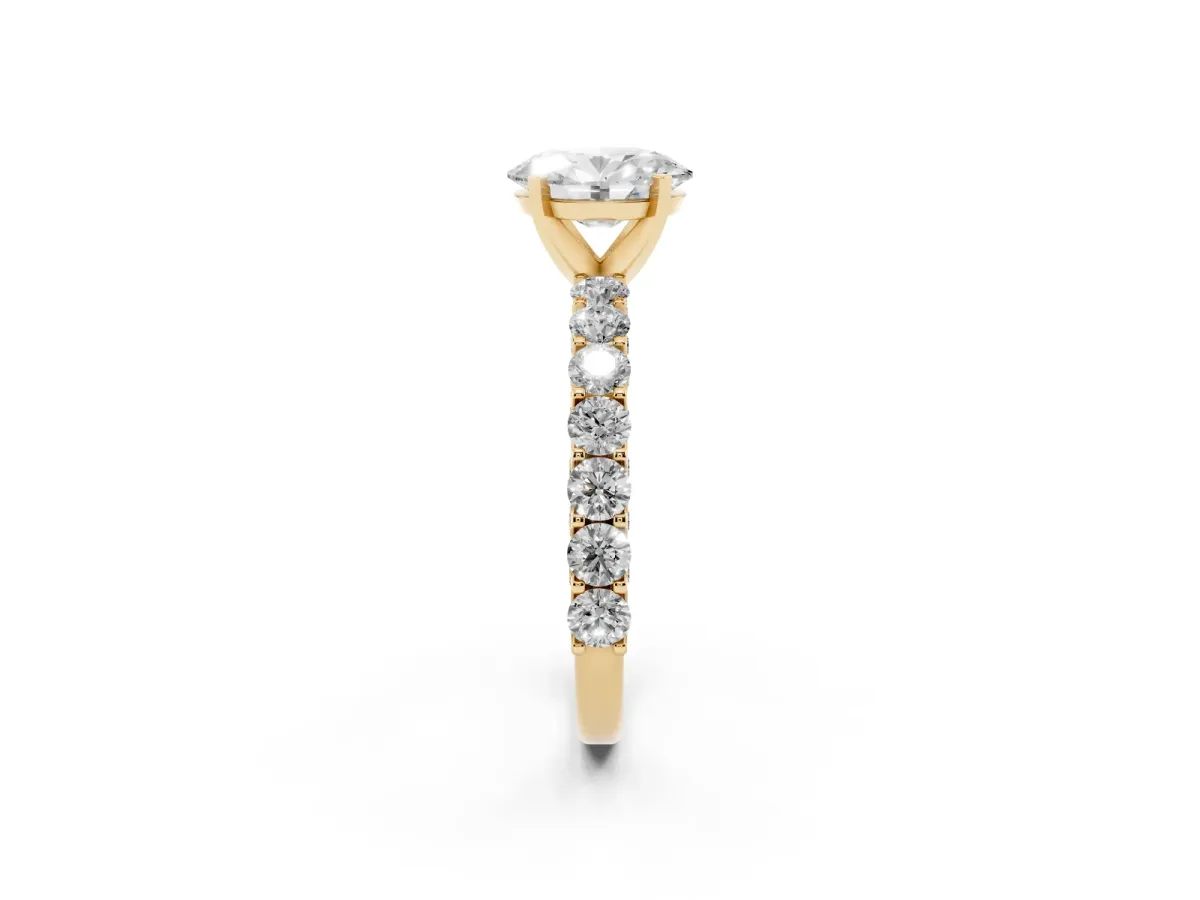 Oval Cut Diamond Solitaire Ring with Shared Prong Pavé Band and Four-Prong Setting Yellow gold