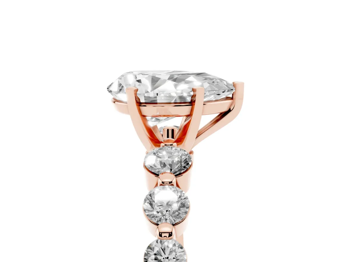 Pear Cut Solitaire Diamond Ring with Pave Band and Four-Prong Setting Rose gold