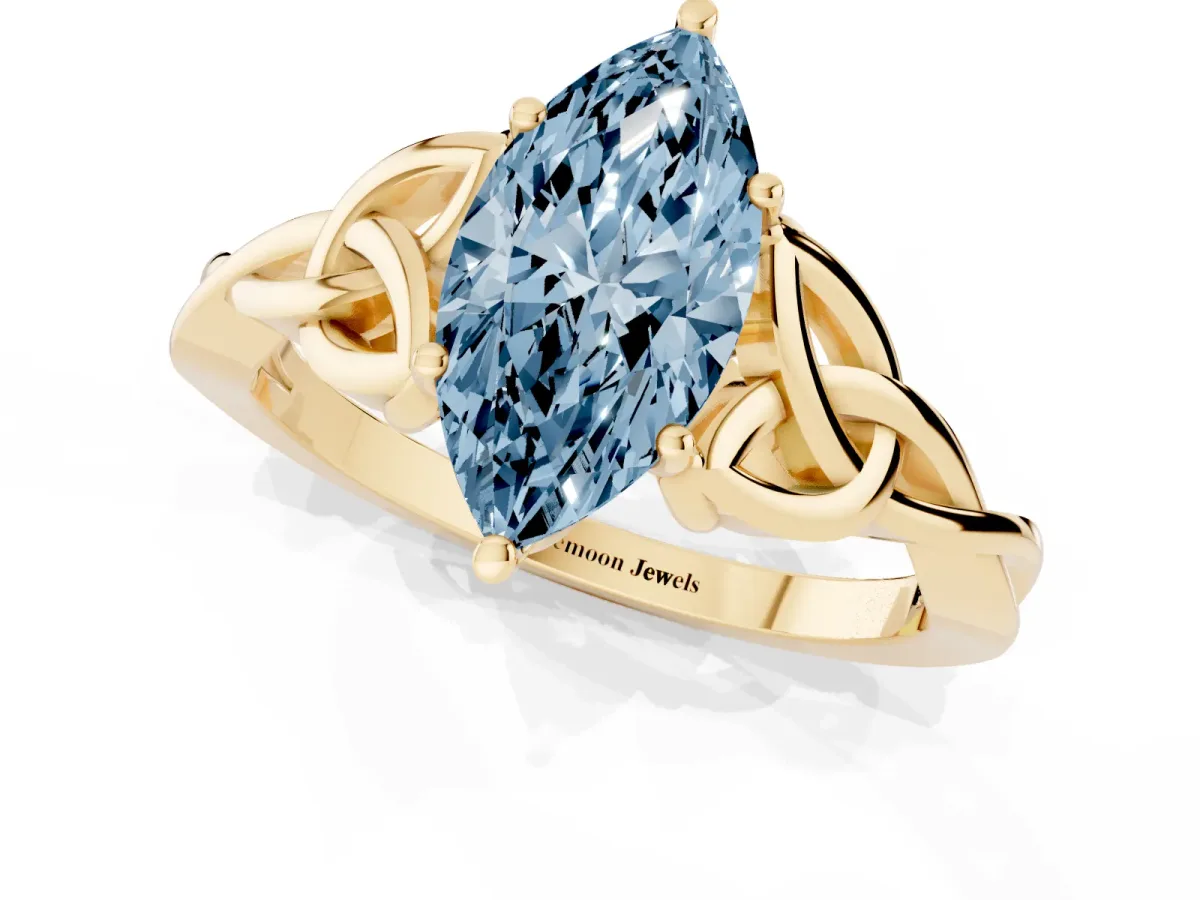 Fancy Blue Marquise Cut Diamond Solitaire Engagement Ring with Celtic Knot Band and Four-Prong Setting Yellow gold