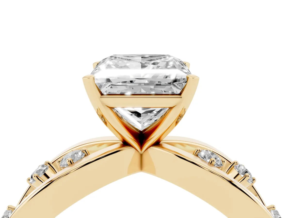 Princess Cut Cut Solitaire Diamond with Side Stones on Criss-Cross Band and Four-Prong Setting Yellow gold