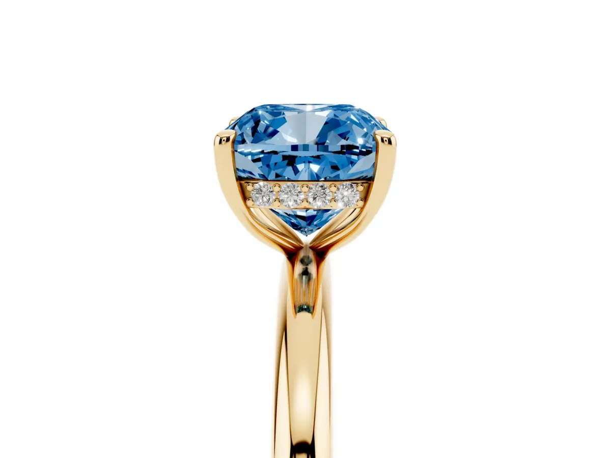 Fancy Blue Cushion Cut Diamond Solitaire Ring with Thin Band and Four-Prong Setting Yellow gold