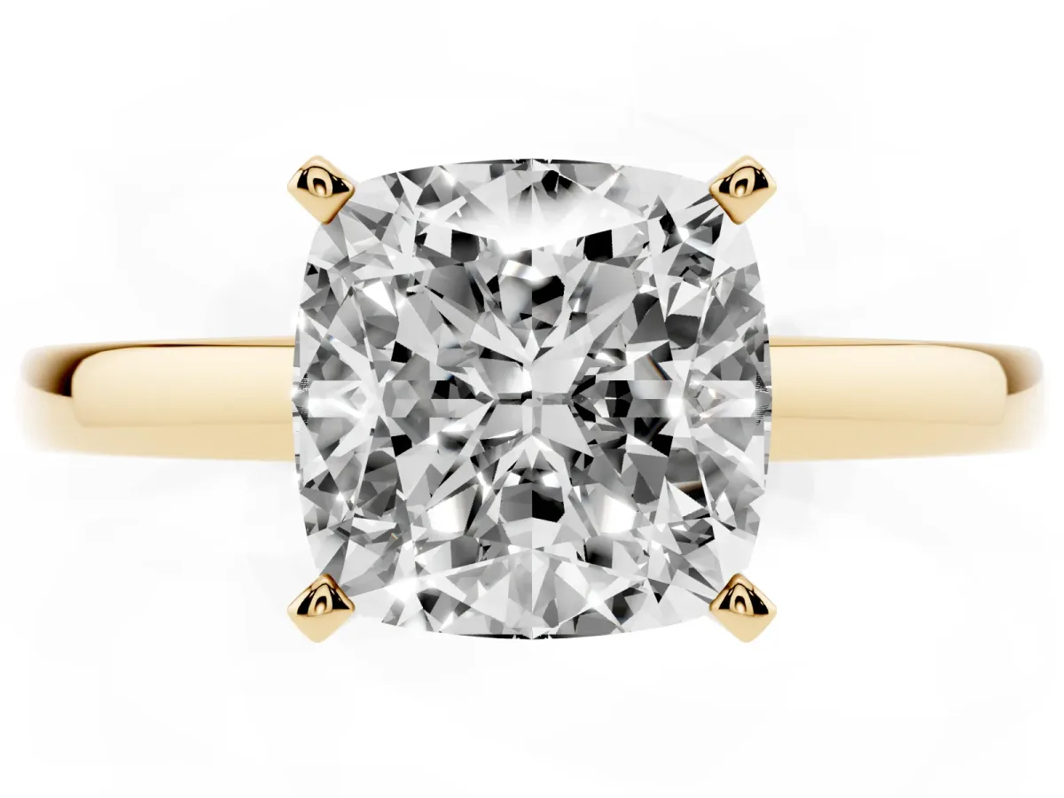 Cushion Cut Solitaire Diamond Engagement Ring with Four-Prong Setting on a Classic Band Yellow gold