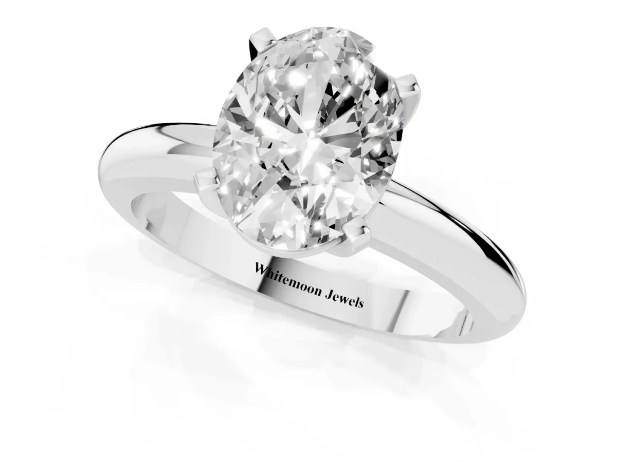 Oval Cut Diamond Solitaire Engagement Ring with Round Band and Four-Prong Setting Platinum