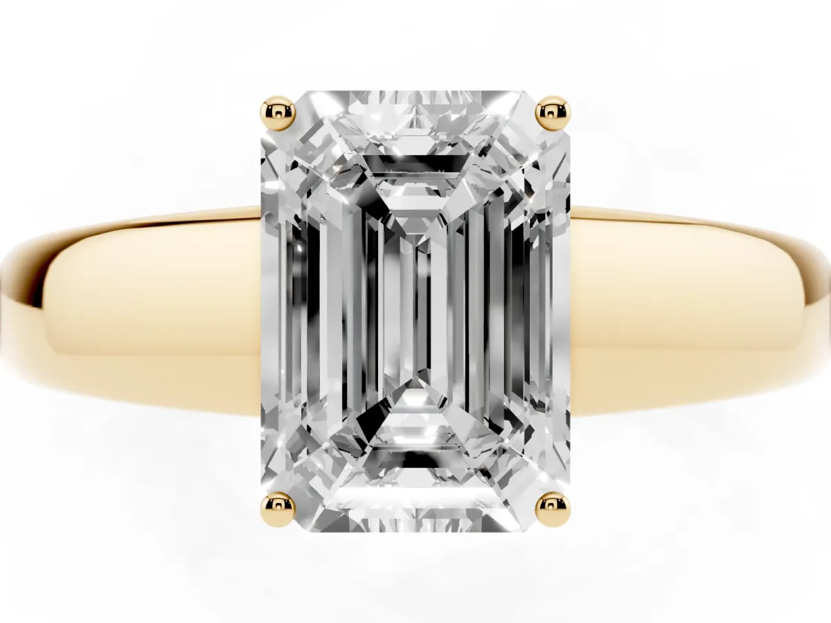 Emerald Cut Solitaire Diamond Ring with Tapered Band and Four-Prong Setting Yellow gold