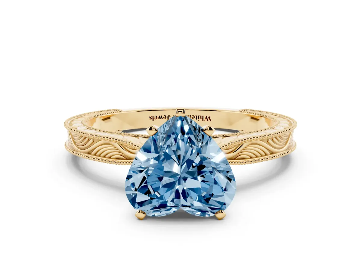 Fancy Blue Heart Cut Solitaire Milgrain Engraved Band with Four-Prong Setting Yellow gold