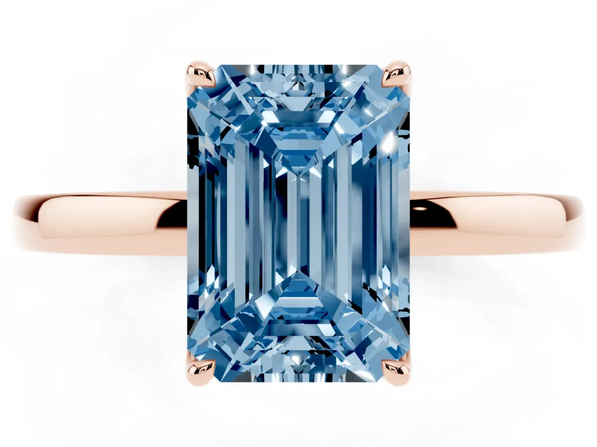Fancy Blue Emerald Cut Diamond Solitaire Ring with Thin Band and Prong Setting Rose gold