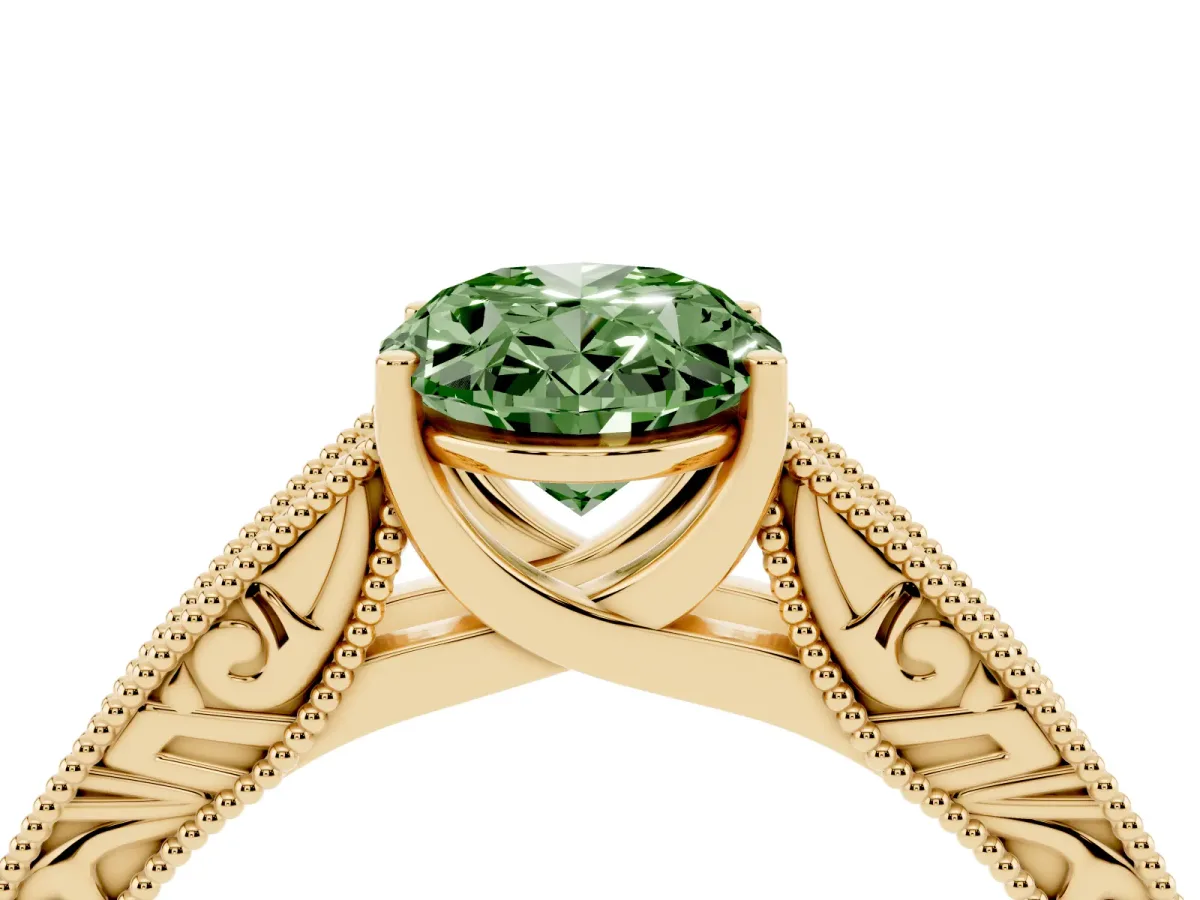 Fancy Green Oval Cut Diamond Solitaire Ring with Engraved Band and Four-Prong Setting Yellow gold