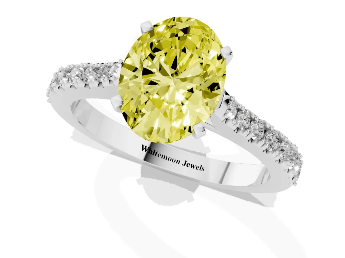 Fancy Yellow Oval Cut Cut Solitaire Diamond Engagement Ring with Pave Band and Four-Prong Setting Platinum