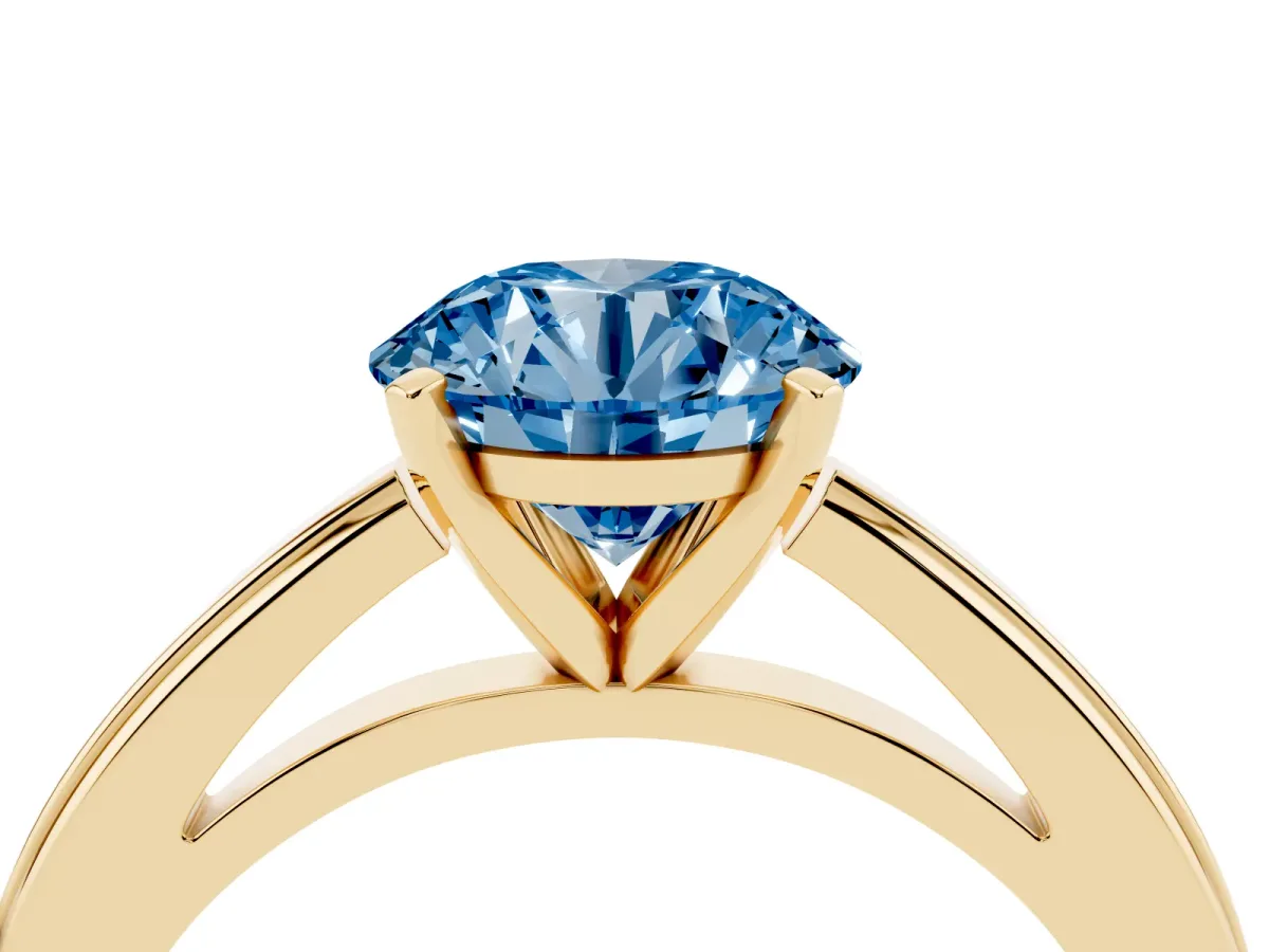 Fancy Blue Round Cut Solitaire Diamond Ring with Four-Prong Setting and Classic Band Yellow gold