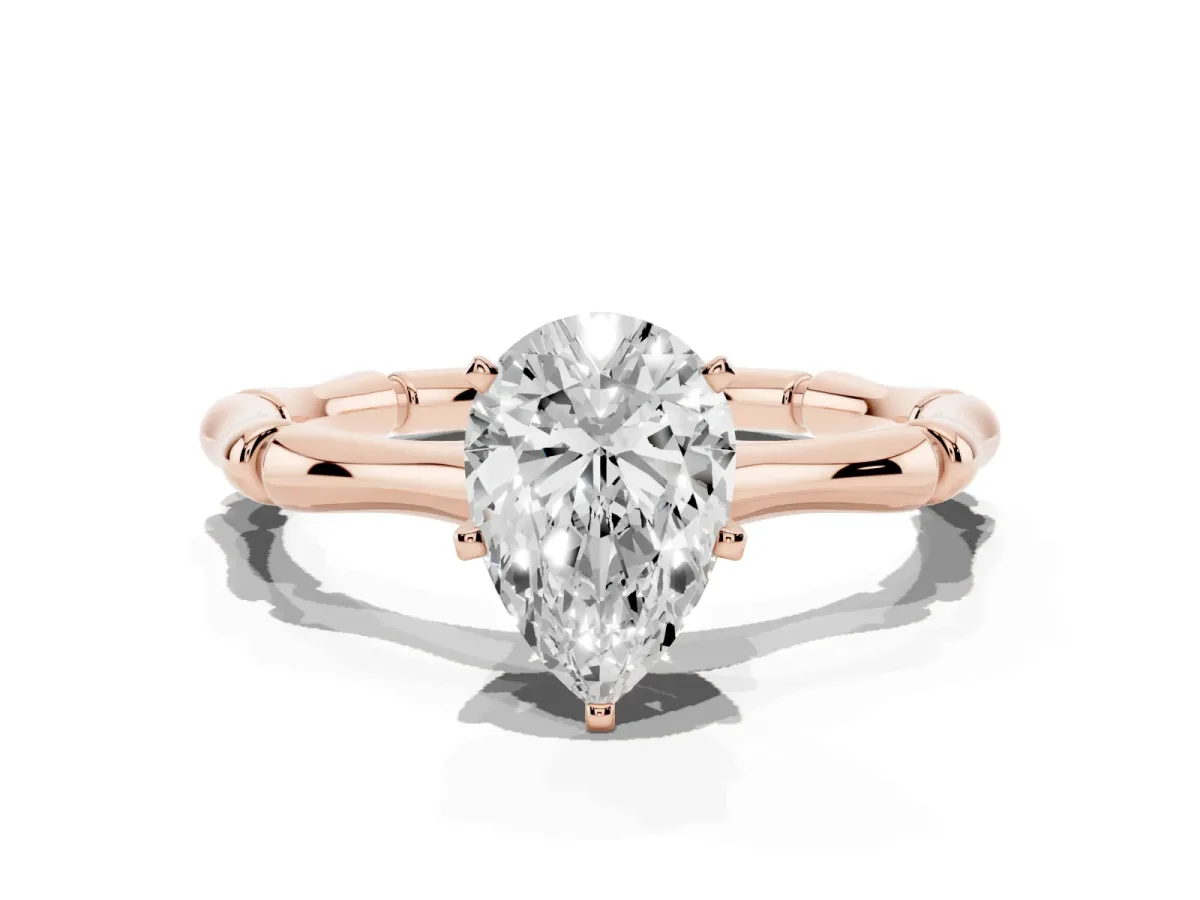 Pear Cut Solitaire Diamond Ring with Bamboo Band and Four-Prong Setting Rose gold