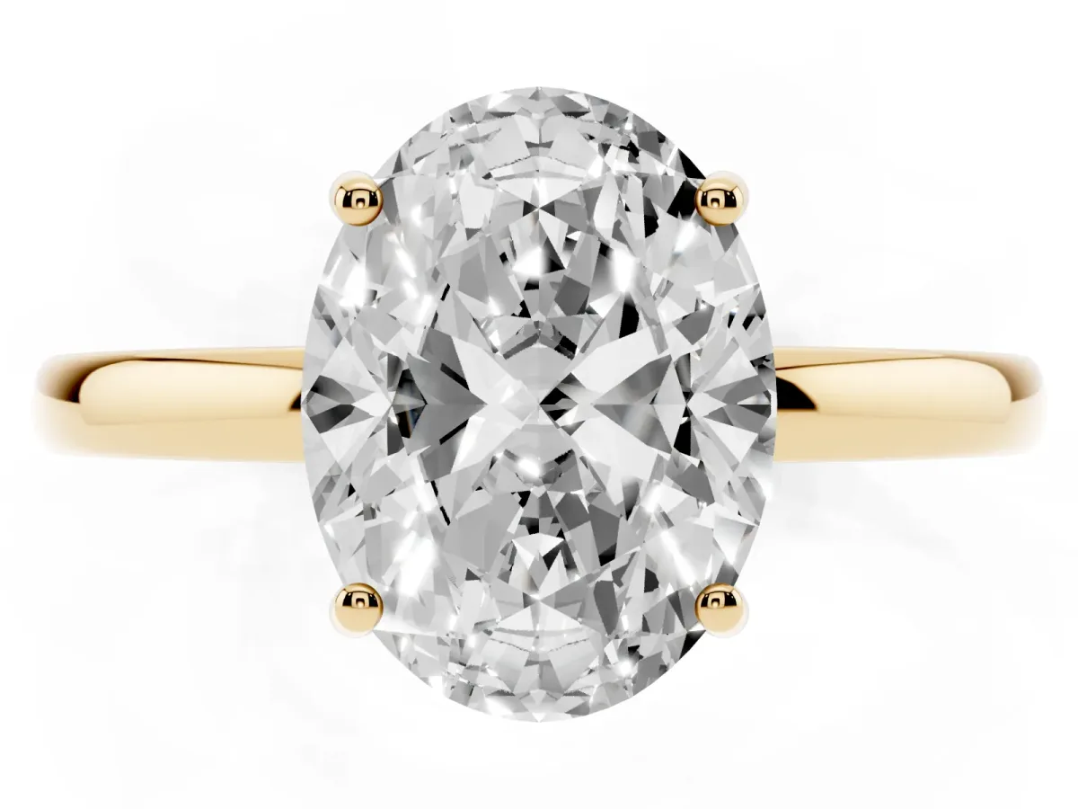 Oval Cut Solitaire Diamond Ring with Prong Setting and Plain Band Yellow gold