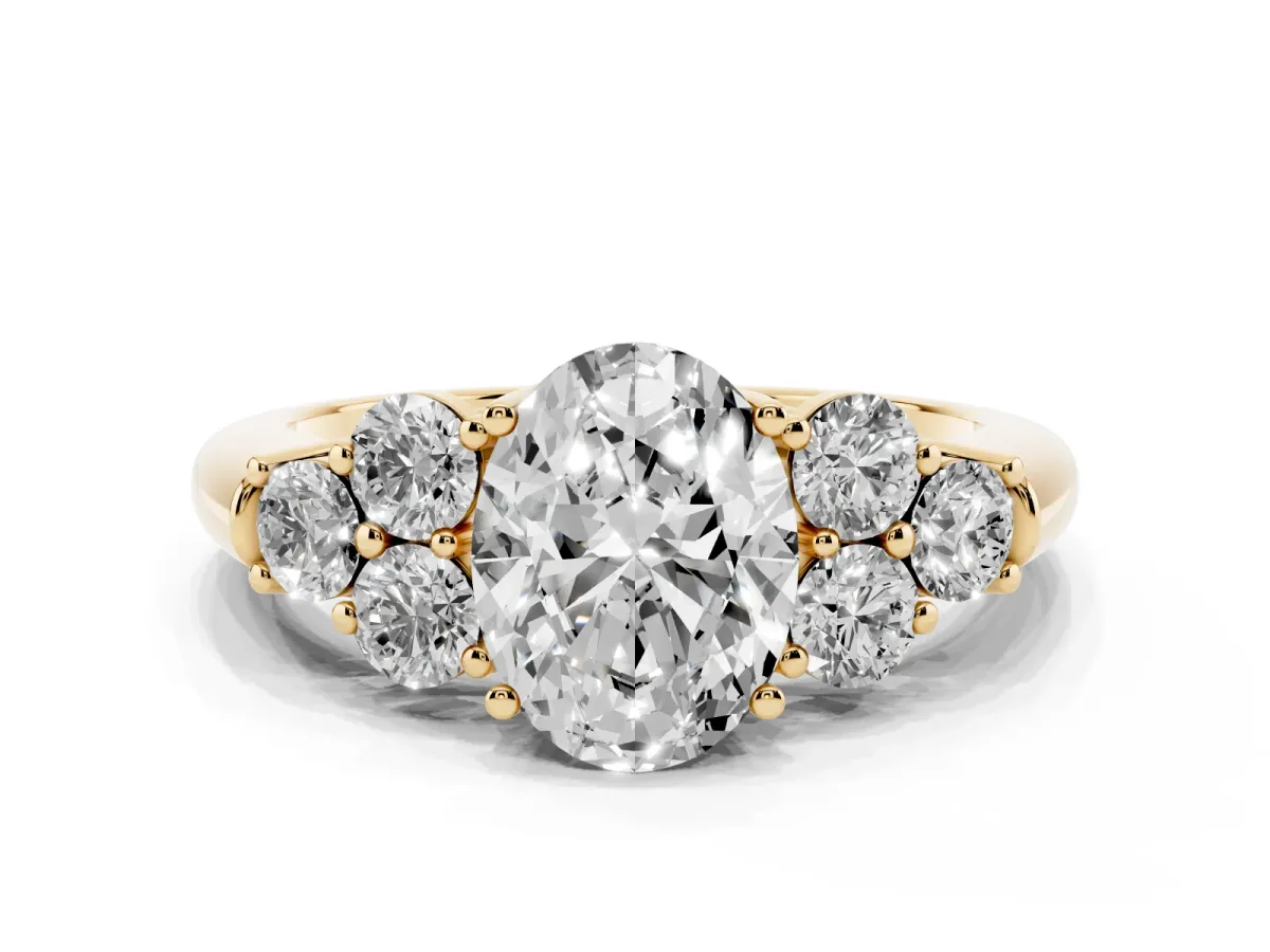 Oval Cut Cut Diamond Cluster Ring with Round Accent Stones and Prong Setting on a Classic Band Yellow gold