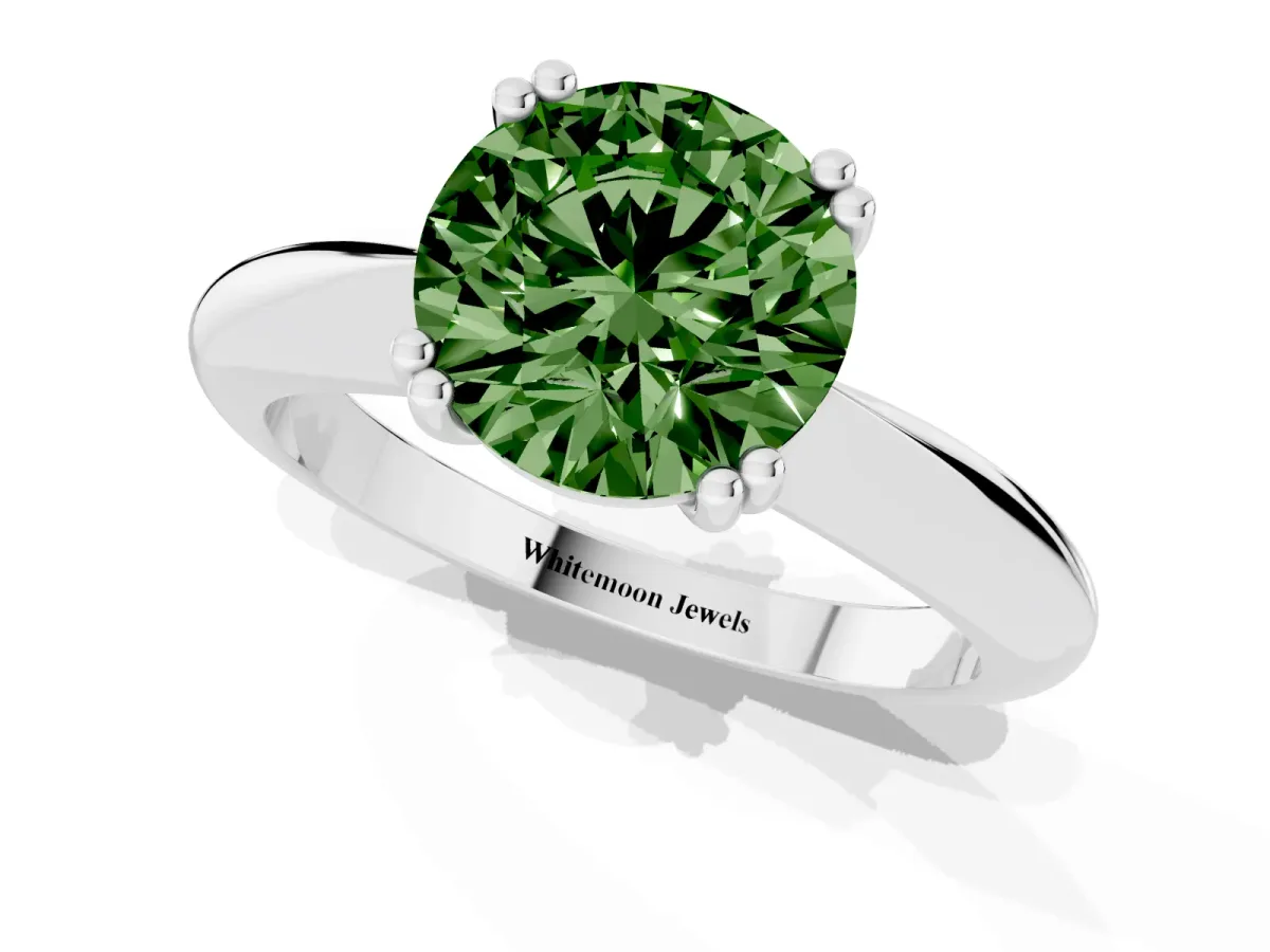 Fancy Green Round Cut Cut Solitaire Engagement Ring with Tapered Band and Four-Prong Setting Silver