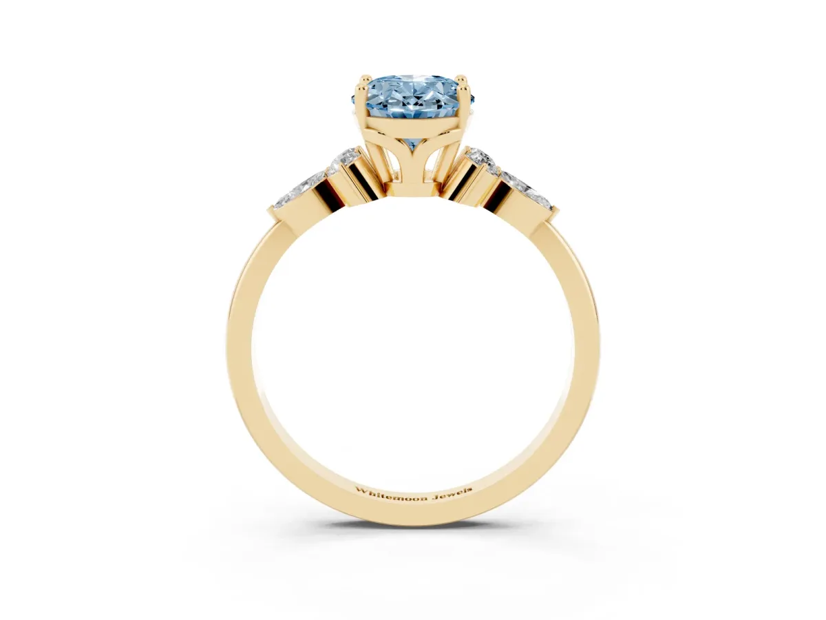 Fancy Blue Oval Cut Brilliant Diamond Solitaire Ring with Pear Side Stones and Four-Prong Setting Yellow gold
