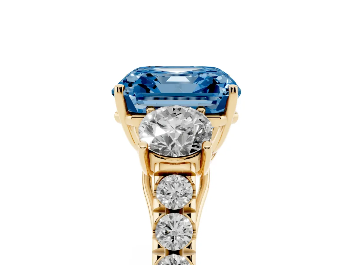 Fancy Blue Asscher Cut Cut Diamond Three-Stone Ring with Round Side Stones and Pavé Band Yellow gold