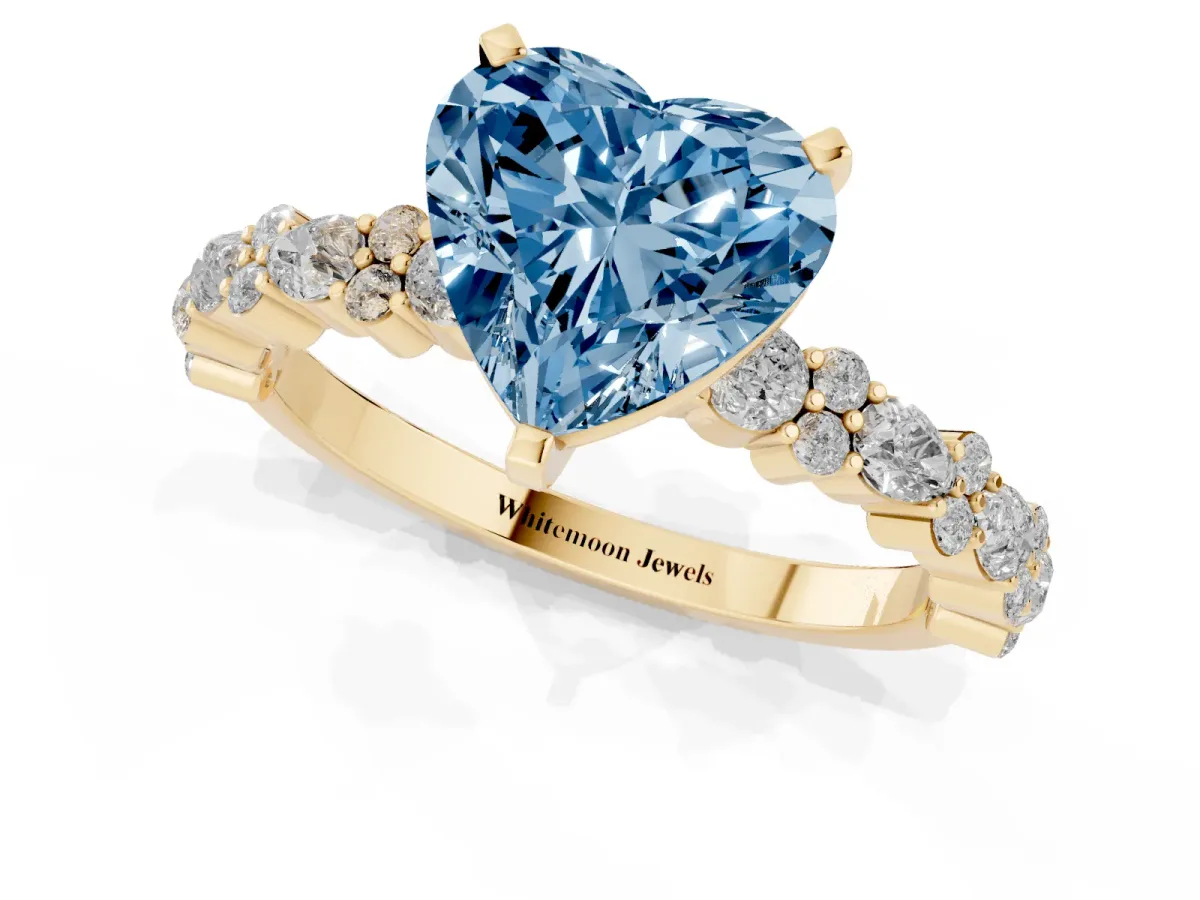 Fancy Blue Heart Cut Diamond Side Stone Solitaire Ring with Round and Four-Prong Setting Yellow gold