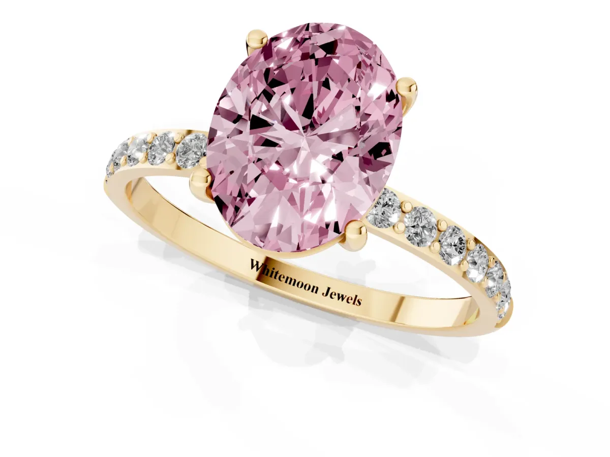 Fancy Pink Oval Cut Diamond Solitaire Ring with Round Pavé Shoulders and Prong Setting Yellow gold