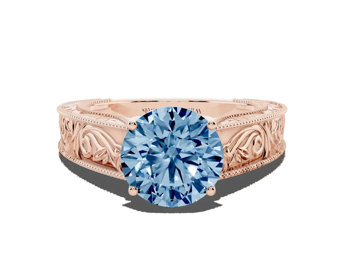 Fancy Blue Round Cut Diamond Solitaire Ring with Engraved Band and Four-Prong Setting Rose gold