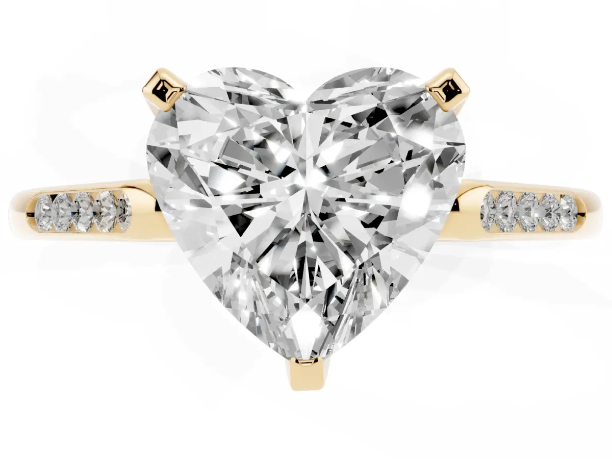 Heart Cut Diamond Solitaire Ring with Channel Set Round Band and Prong Setting Yellow gold