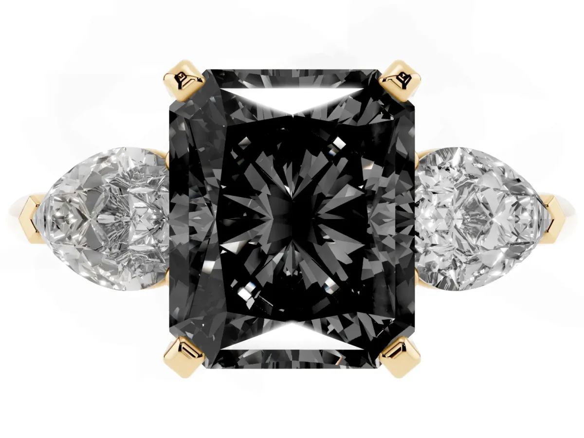 Fancy Black Three-Stone Radiant Cut Diamond Ring with Pear Side Stones and Four-Prong Setting Yellow gold