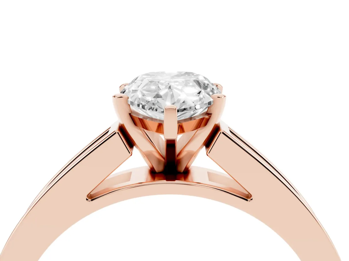 Pear Cut Solitaire Diamond Ring with Channel-Set Band and Four-Prong Setting Rose gold