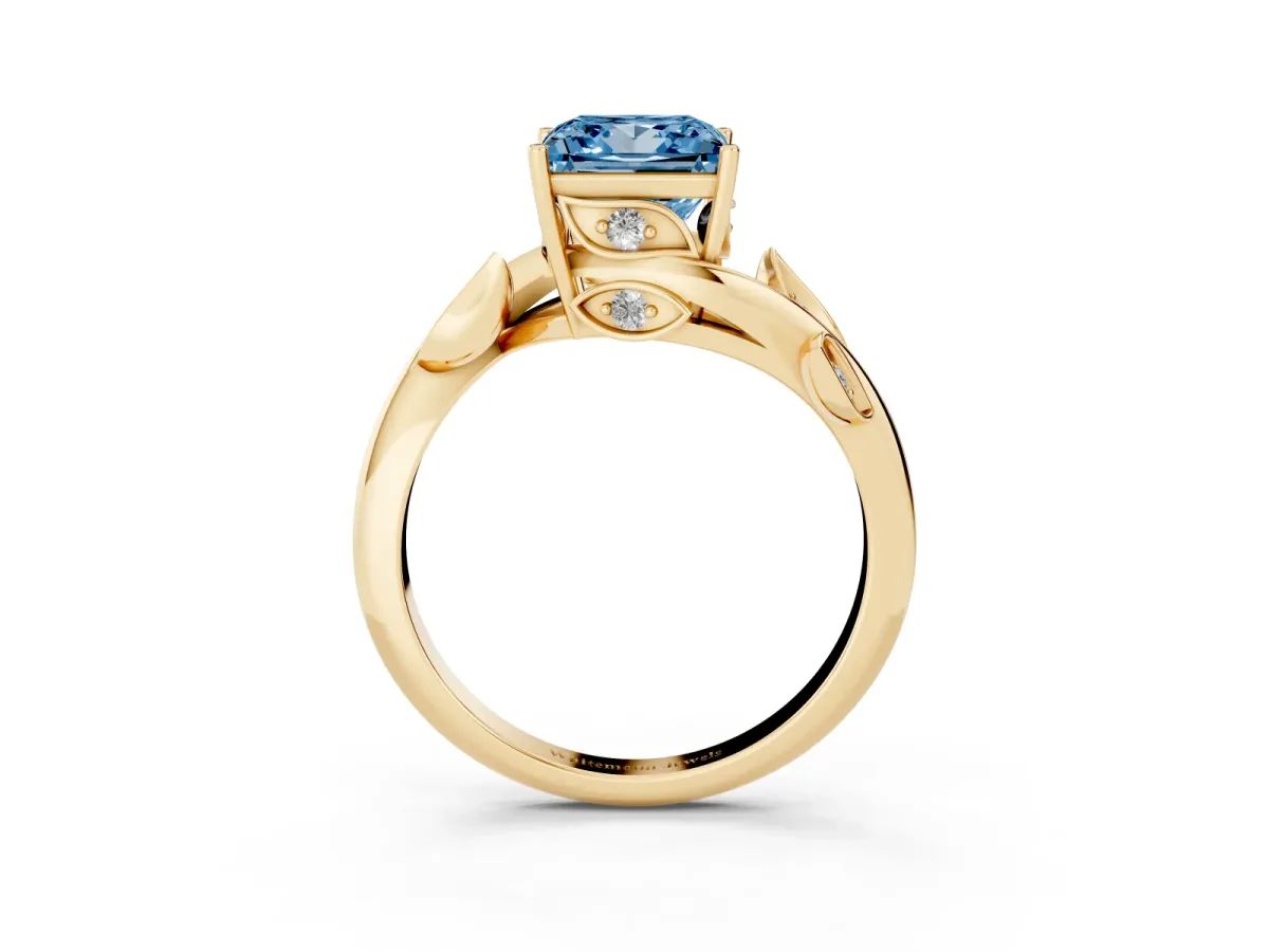 Fancy Blue Princess Cut Solitaire Twist Engagement Ring with Leaf Accents and Prong Setting Yellow gold