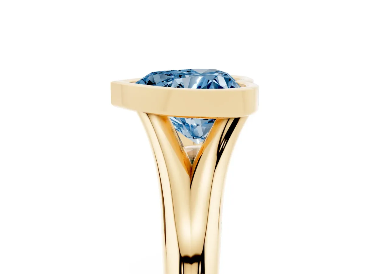 Fancy Blue Bezel Set Heart Cut Solitaire Diamond Ring with Smooth Band Yellow gold