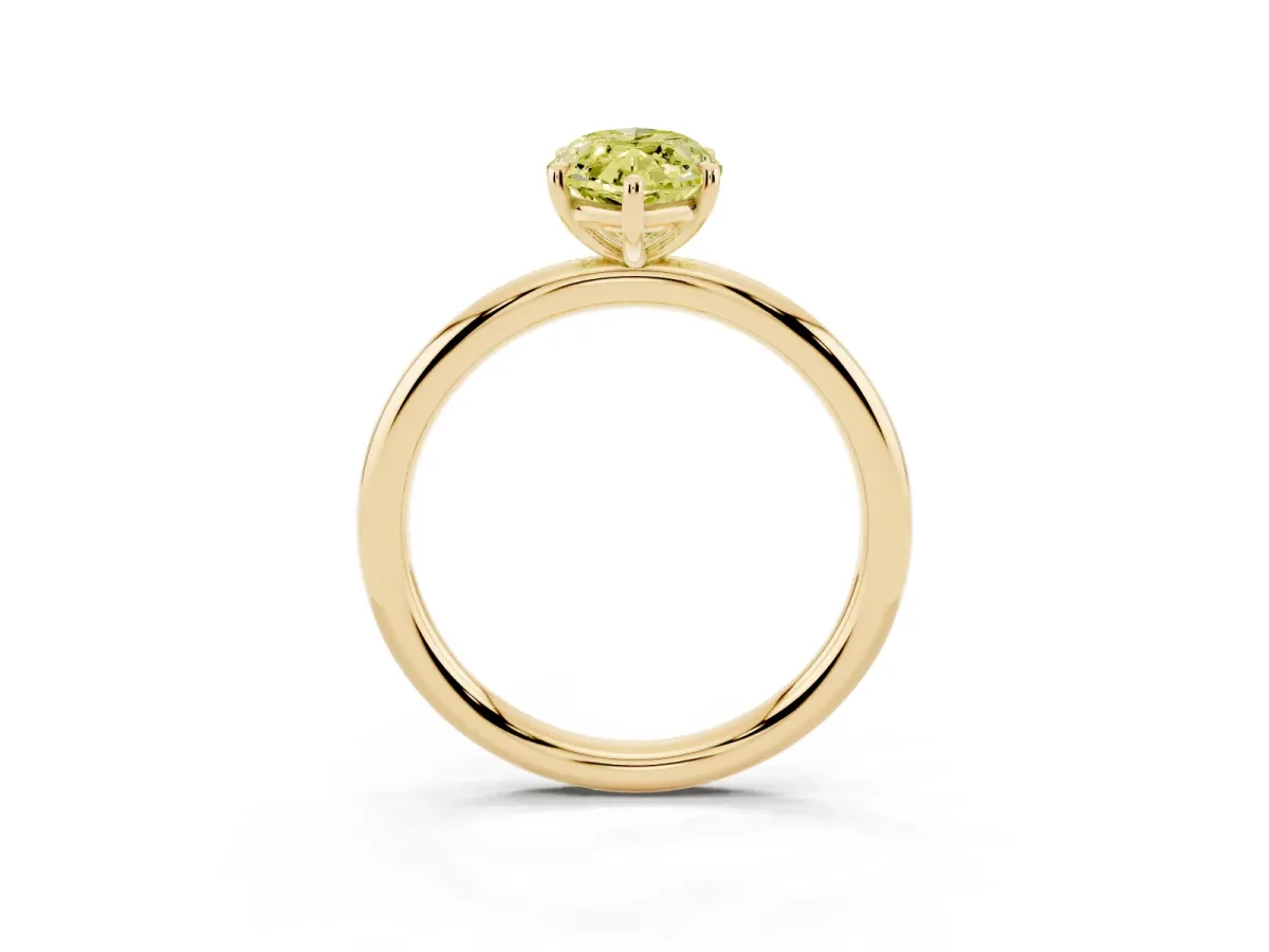 Fancy Yellow Oval Cut Solitaire Diamond Ring with Four-Prong Setting on a Plain Band Yellow gold