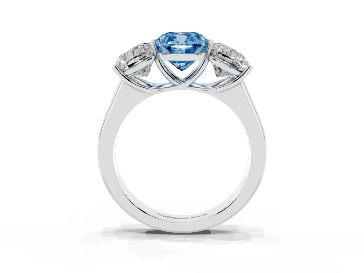 Fancy Blue Cushion Cut Three-Stone Diamond Ring with Prong Setting on a Classic Band Silver