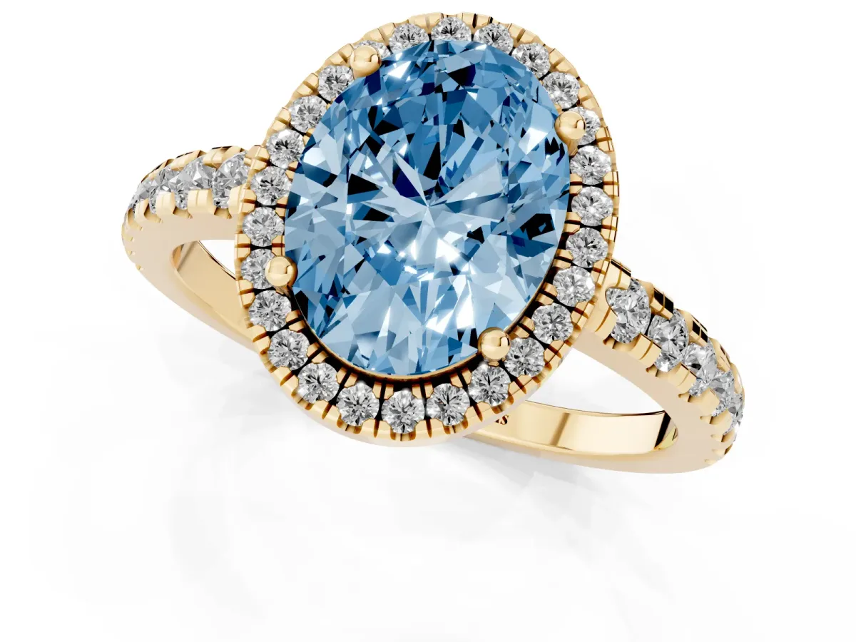 Fancy Blue Oval Cut Diamond Halo Ring with Pavé Band and Four-Prong Setting Yellow gold