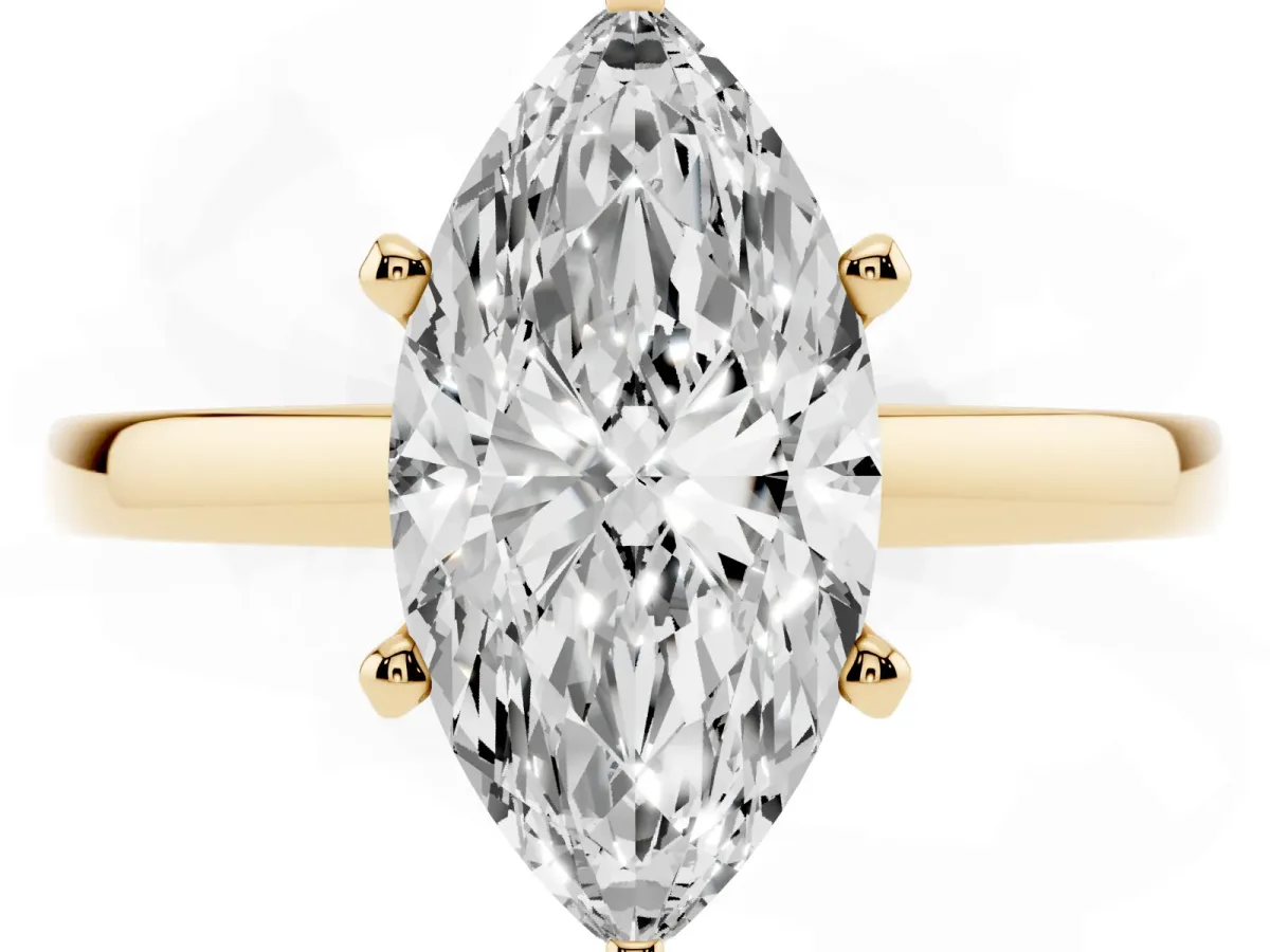 Marquise Cut Solitaire Diamond Engagement Ring with Four-Prong Setting on a Classic Band Yellow gold