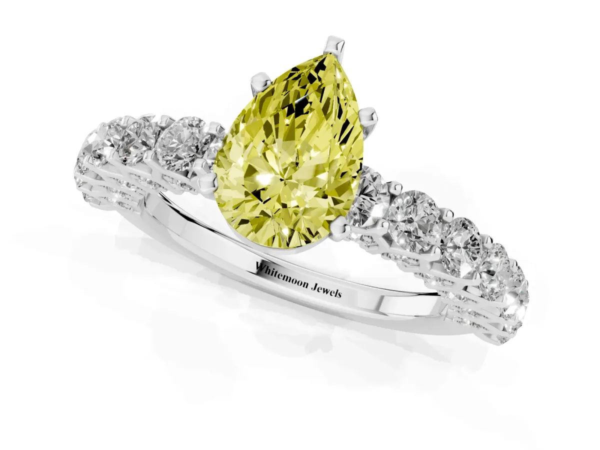 Fancy Yellow Pear Cut Diamond Solitaire Ring with Shared Prong Pavé Band and Four-Prong Setting Silver