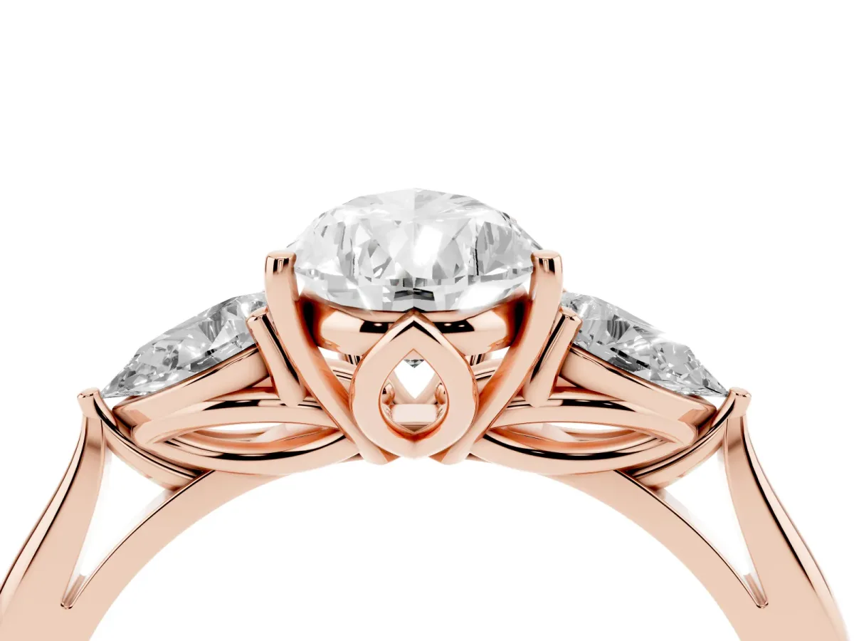 Three-Stone Pear Cut Diamond Ring with Pear Side Stones in Four-Prong Setting Rose gold