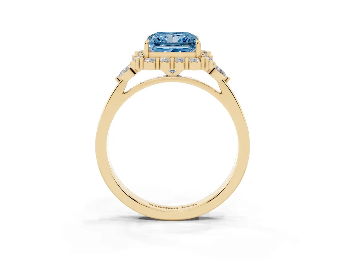 Fancy Blue Princess Cut Diamond Halo Ring with Pear Side Stones and Prong Setting Yellow gold