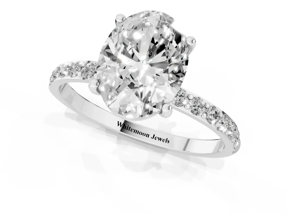 Oval Cut Diamond Solitaire Ring with Round Pavé Shoulders and Prong Setting Platinum