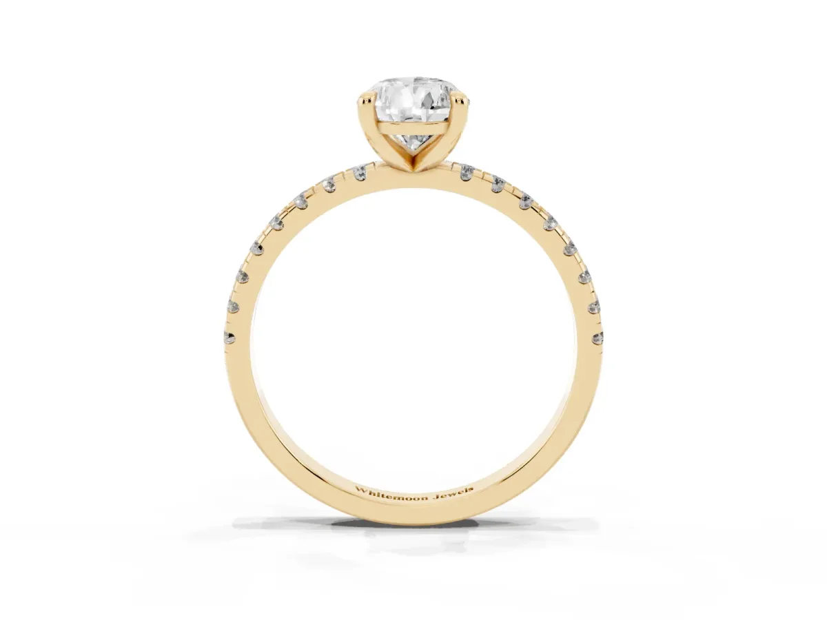 Pear Cut Diamond Brilliant Solitaire Ring with Pavé Band and Four-Prong Setting Yellow gold