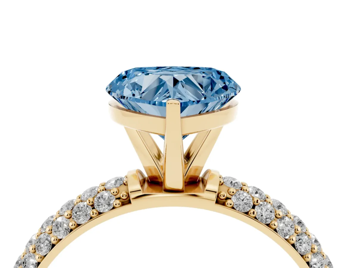 Fancy Blue Heart Cut Diamond Solitaire Ring with Prong Setting and Pavé Band Yellow gold