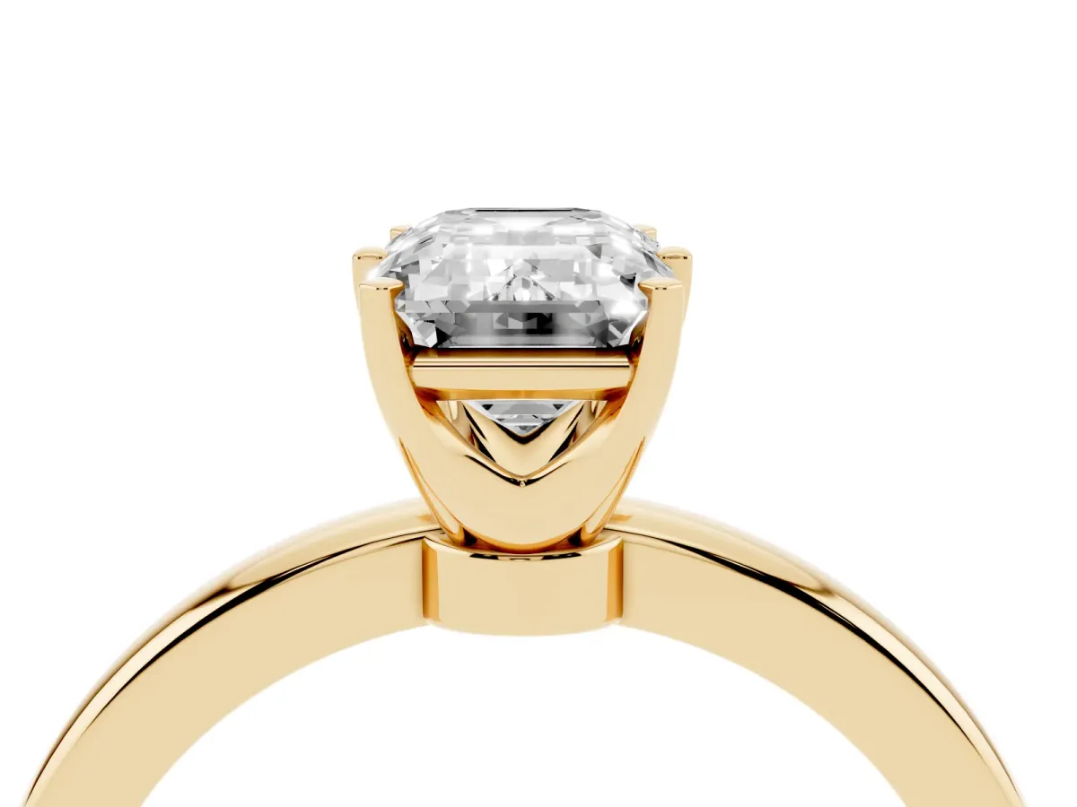 Emerald Cut Solitaire Diamond Ring with Six-Prong Setting on a Classic Band Yellow gold