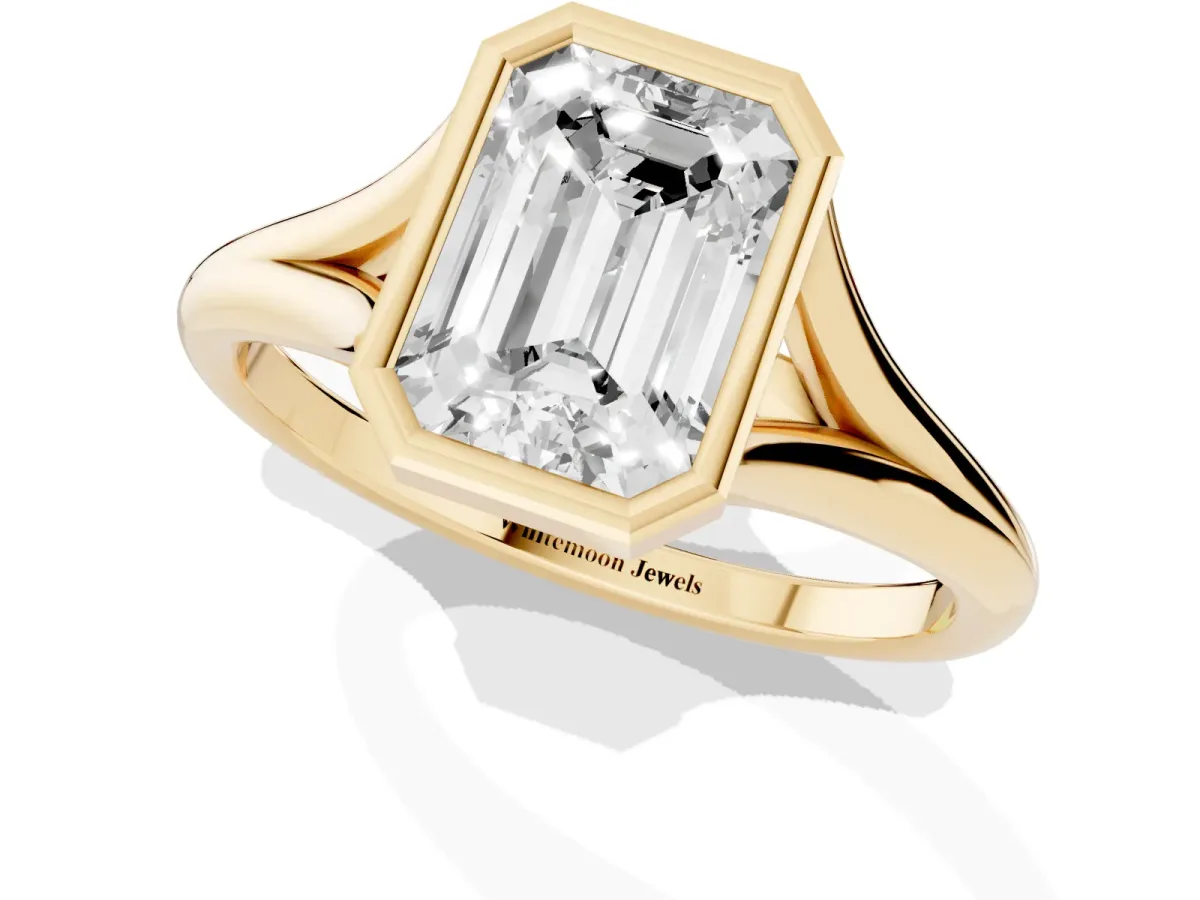 Bezel Set Emerald Cut Cut Solitaire Ring with Tapered Band Yellow gold