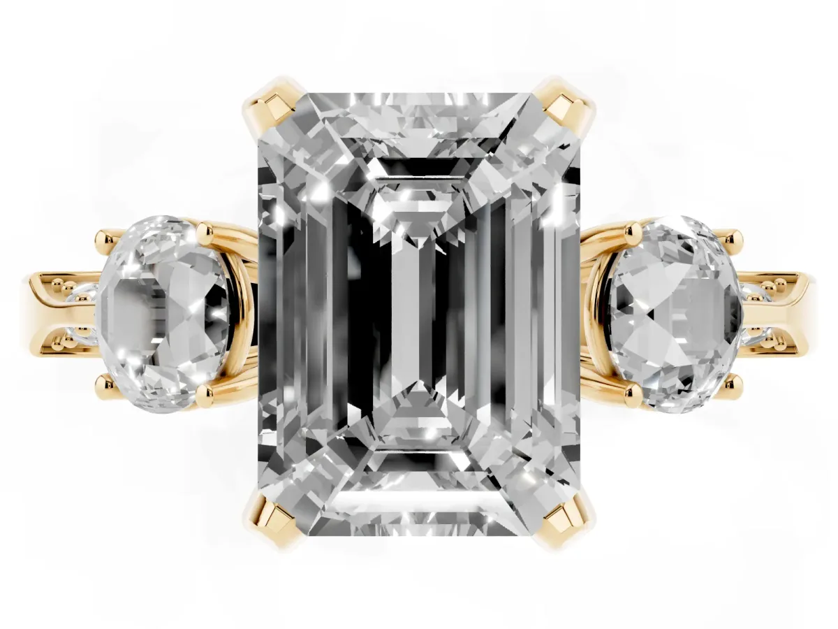 Fancy Blue Emerald Cut Brilliant Three-Stone Diamond Ring with Pavé Band and Four-Prong Setting Yellow gold