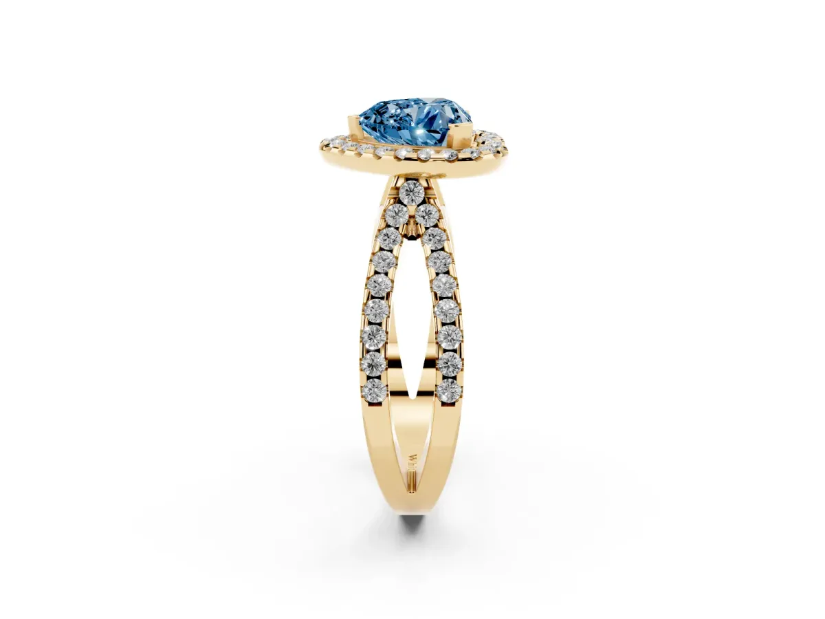 Fancy Blue Heart Cut Diamond Halo Ring with Split Shank Pavé Band and Prong Setting Yellow gold