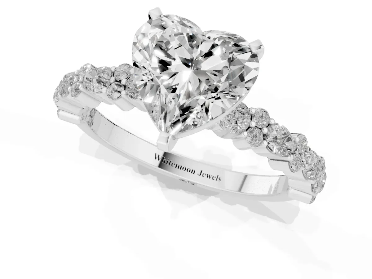 Heart Cut Diamond Side Stone Solitaire Ring with Round and Four-Prong Setting White gold