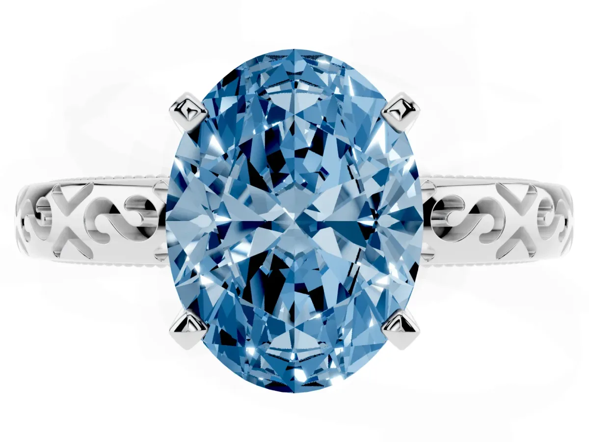 Fancy Blue Oval Cut Solitaire Engagement Ring with Scrollwork Band and Four-Prong Setting Silver