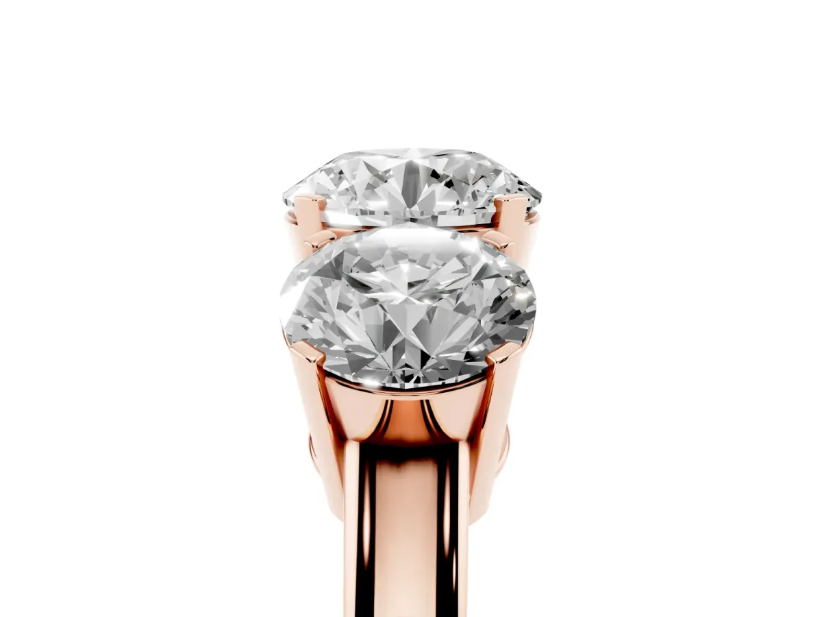 Three-Stone Round Cut Cut Diamond Ring with Channel Set Band and Four-Prong Setting Rose gold