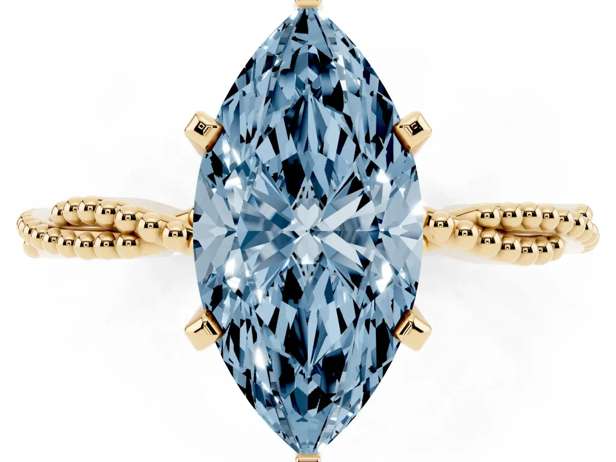 Fancy Blue Marquise Cut Solitaire Twisted Band with Bead Prong Setting Yellow gold