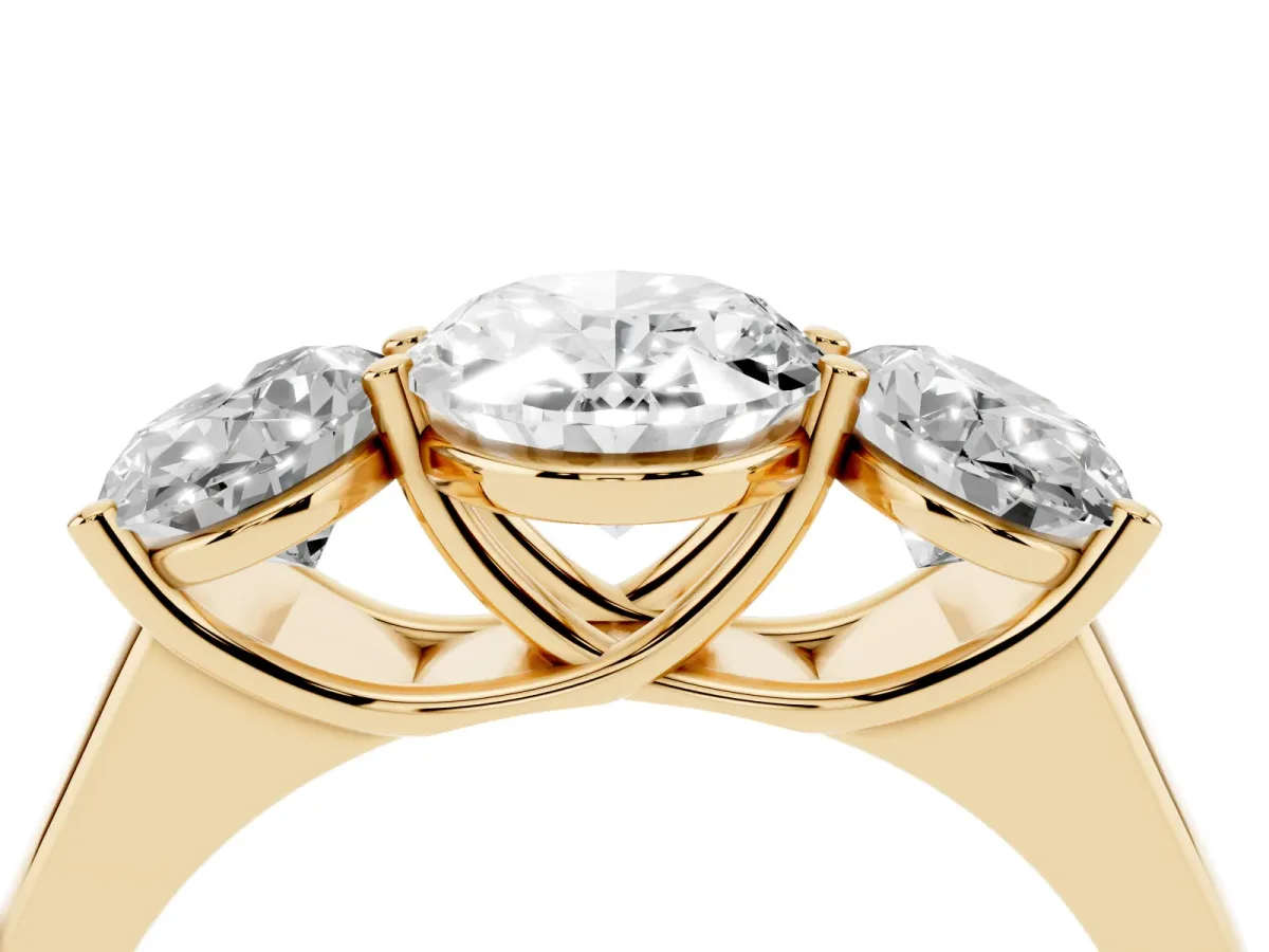 Oval Cut Three-Stone Diamond Ring with Prong Setting on a Classic Band Yellow gold
