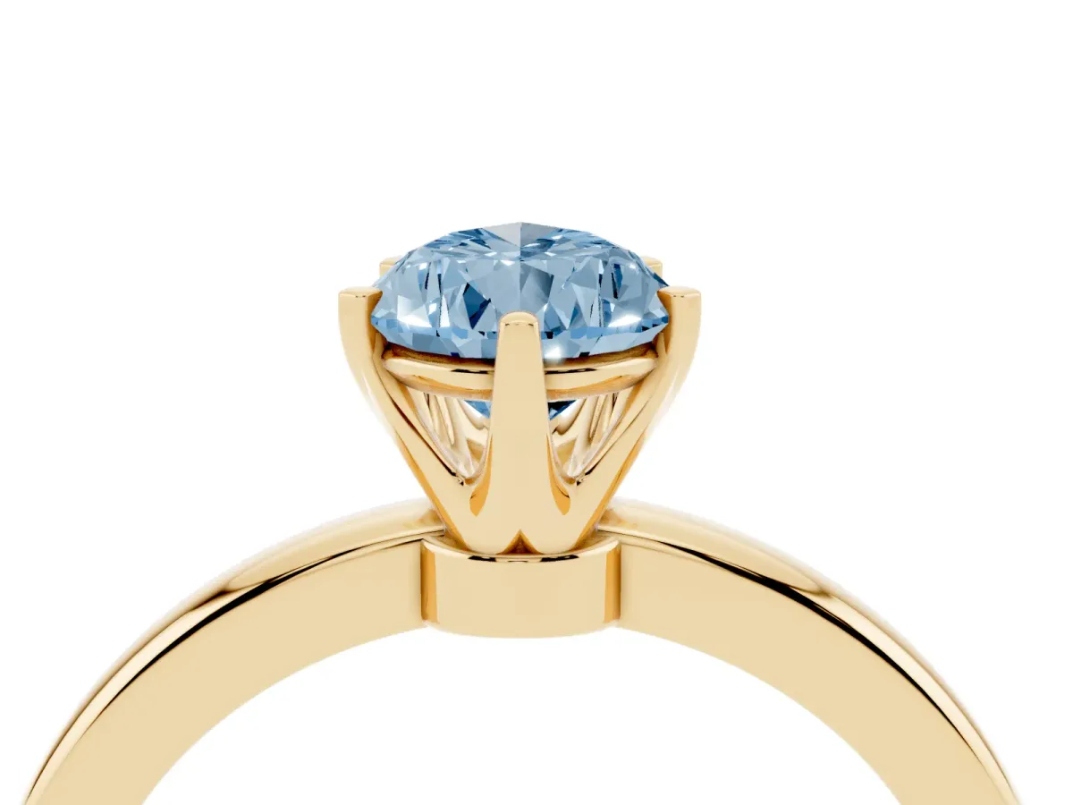 Fancy Blue Pear Cut Solitaire Diamond Ring with Six-Prong Setting on a Classic Band Yellow gold