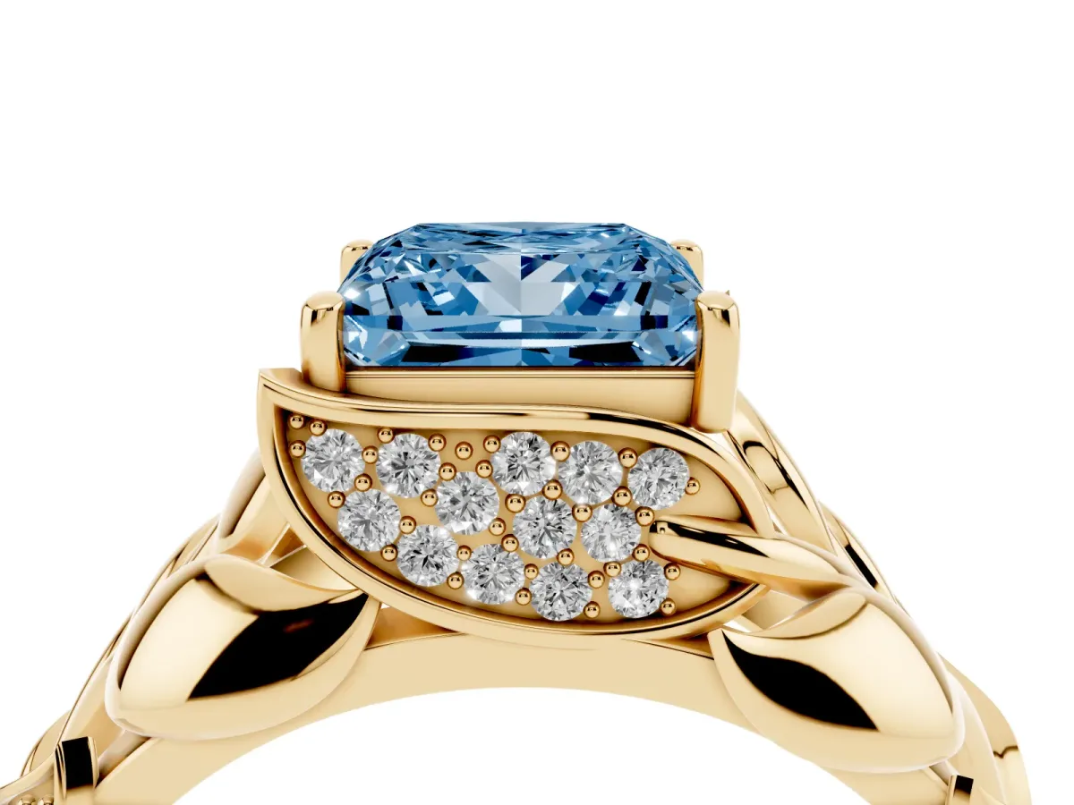 Fancy Blue Princess Cut Diamond Leaf-Inspired Engagement Ring with Round Accents and Prong Setting Yellow gold
