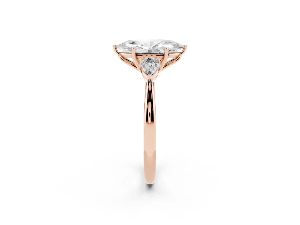 Three-Stone Marquise Cut Diamond Ring with Pear Side Stones in Four-Prong Setting Rose gold